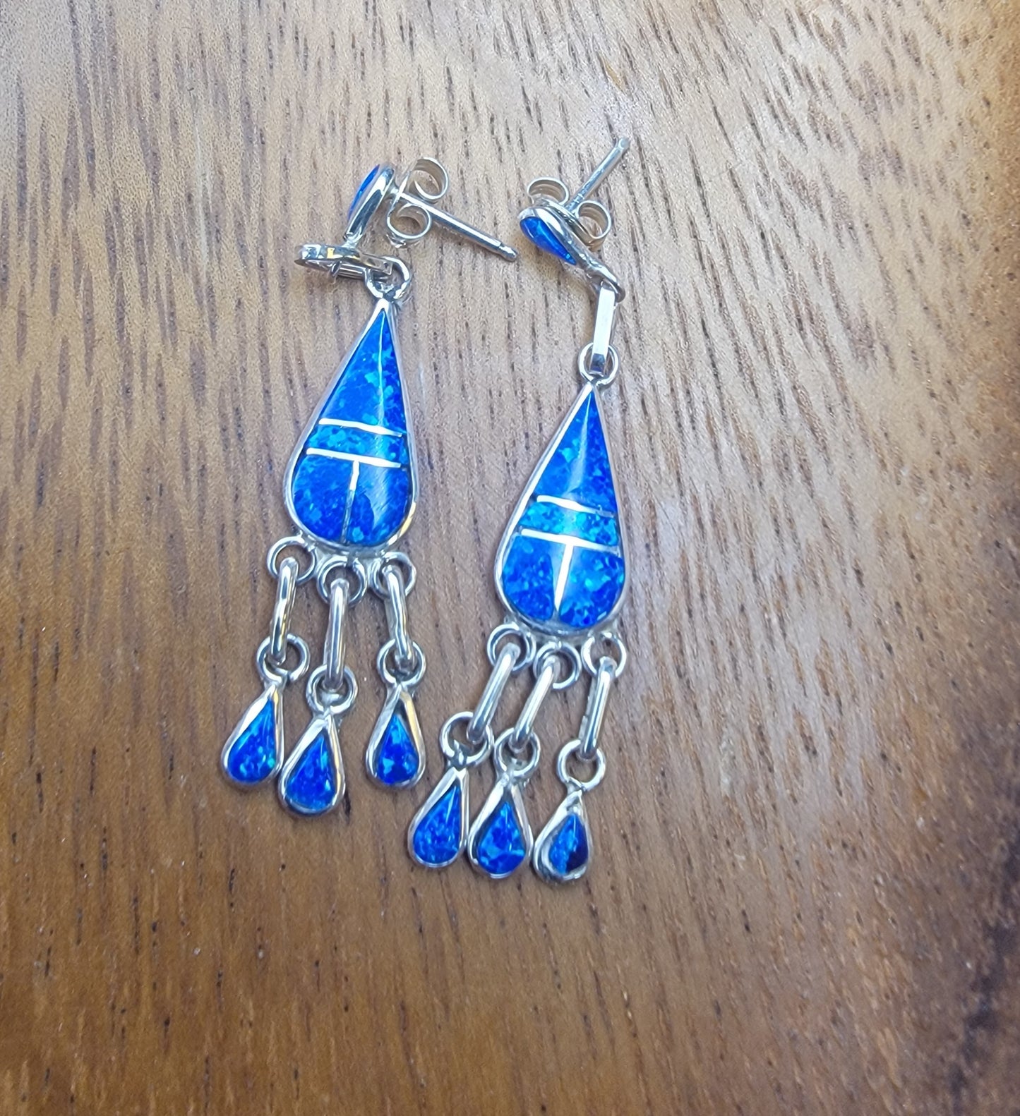Stylish Handcrafted opal inlay dangle earrings with shimmering opal drops, perfect for any occasion.