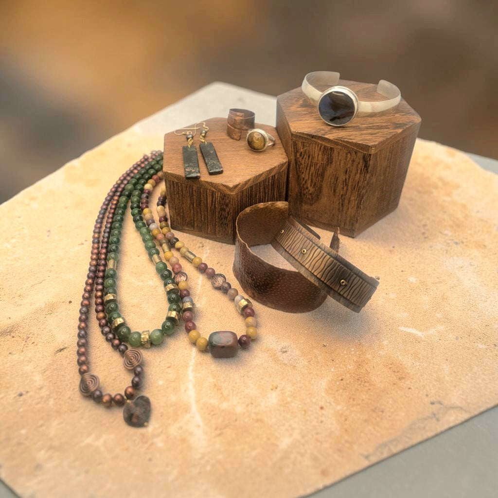 Group of earth tone copper, beaded and silver jewelry