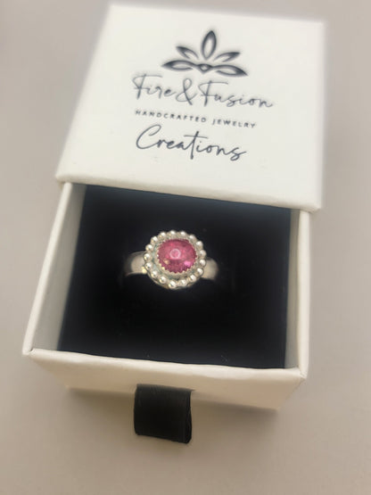 Pink Tourmaline and Sterling silver ring with bead detail around the bezel in white branded gift box that has the text 'Fire and Fusion Creations Handcrafted Jewelry'