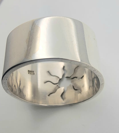 Detailed image of the 925 Sterling Silver Wideband Sunburst Ring, emphasizing its polished finish and sunburst cutout. This handcrafted ring represents modern silver ring craftsmanship, ideal for those who love bold silver bands and celestial jewelry.