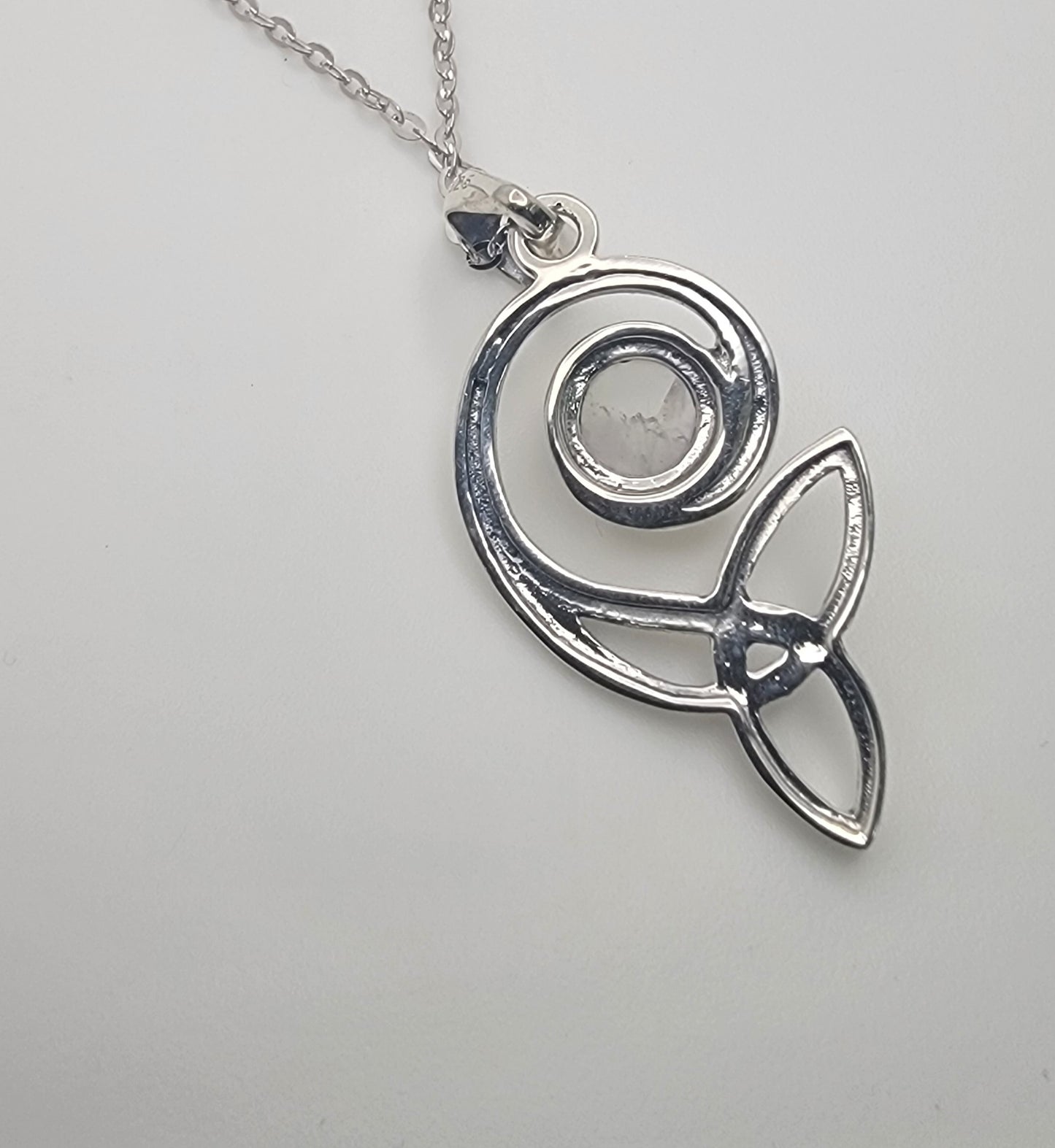 Close-up of the Celtic Swirl Sterling Silver Moonstone Necklace showcasing the intricate design and luminous cabochon moonstone.