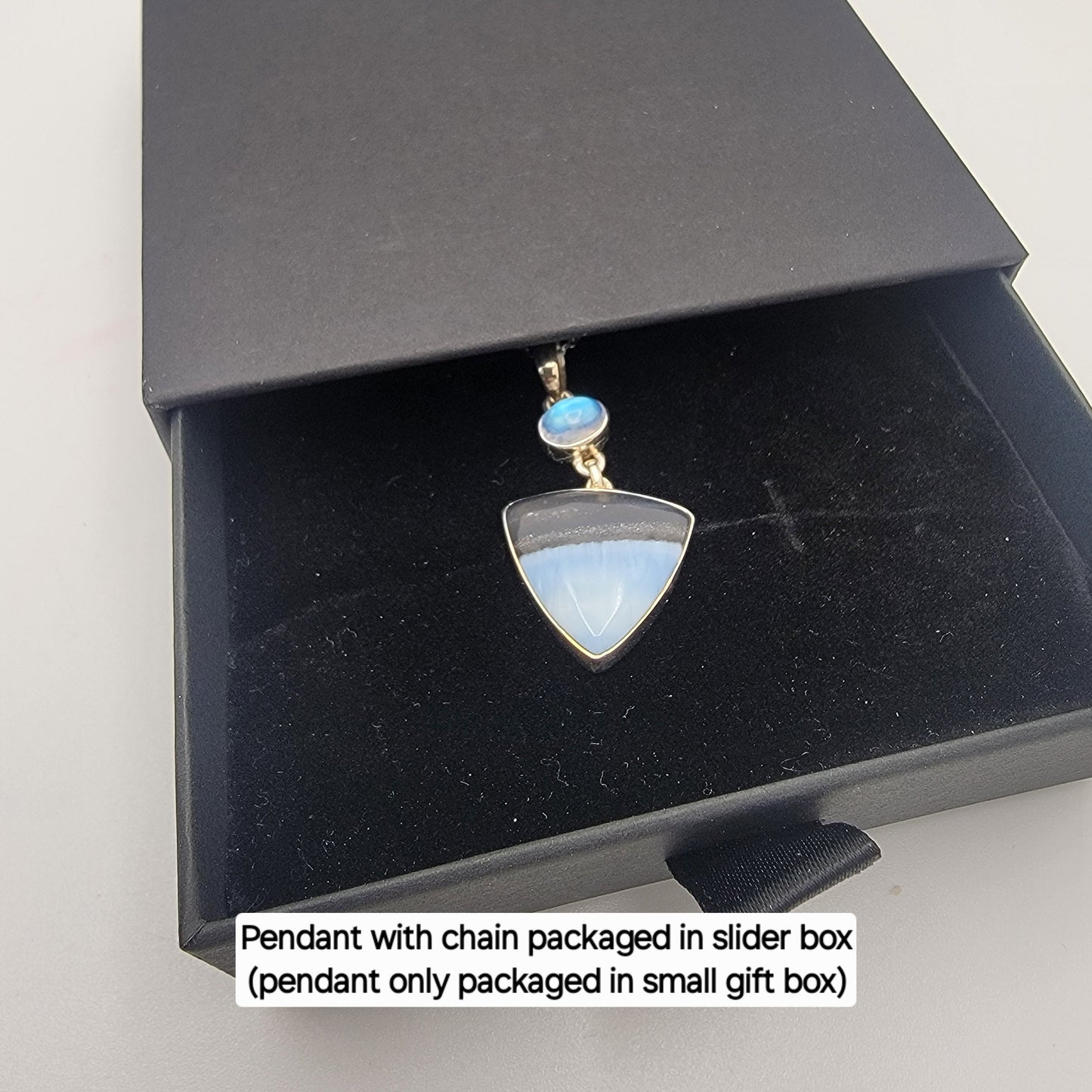 Blue opal necklace in black slider box