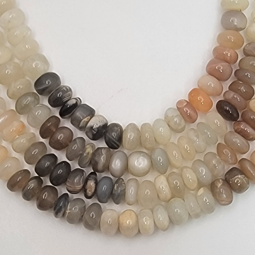 Multicolored beaded strands on a white background
