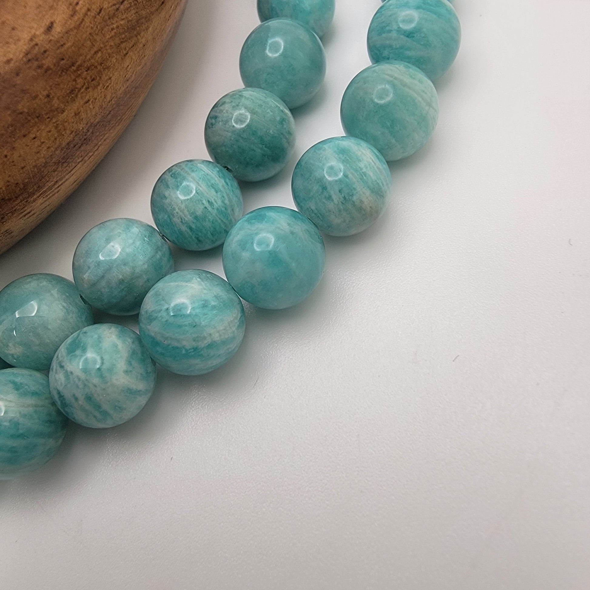 Amazonite beads on a white background