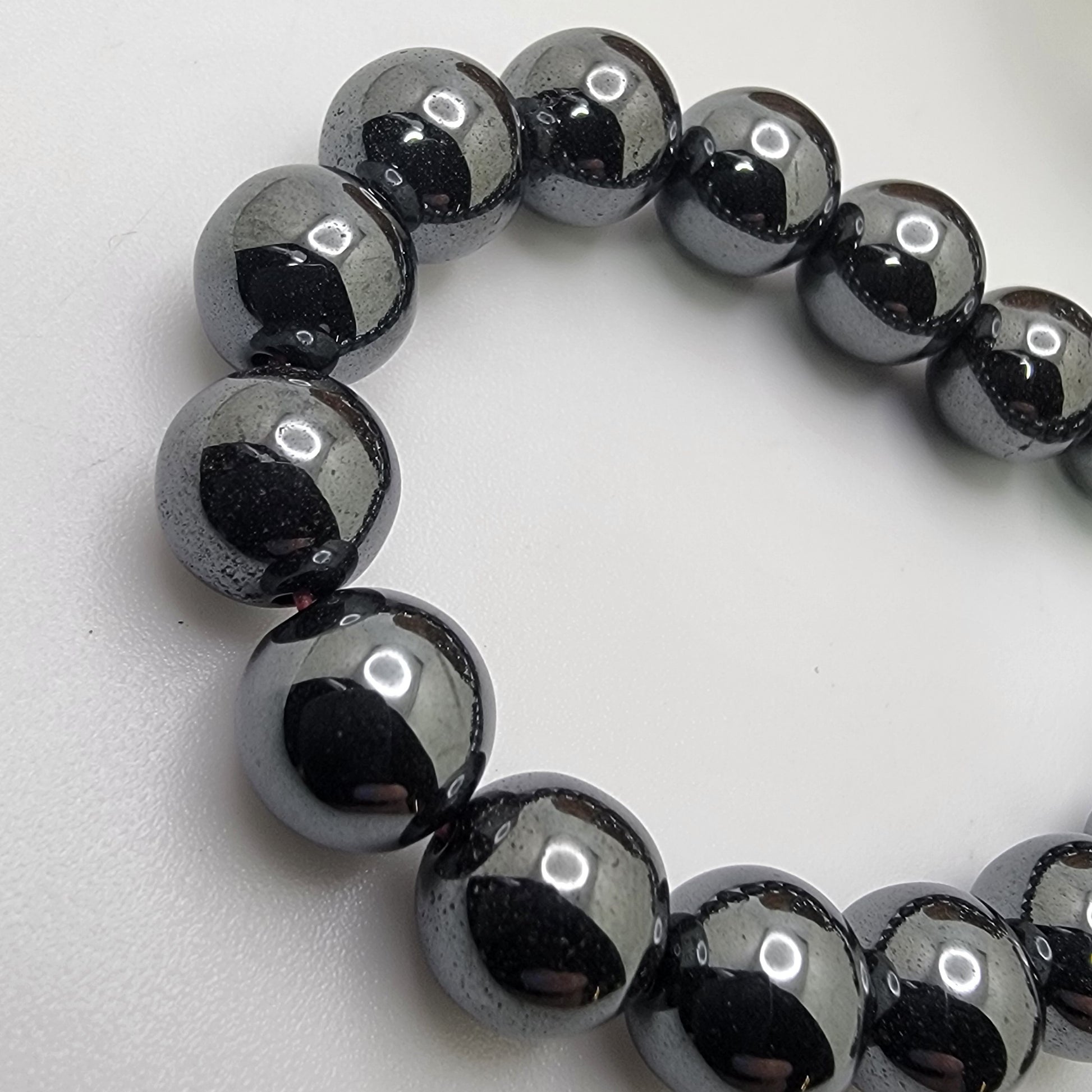 Black beads on a white background