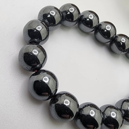 Black beads on a white background