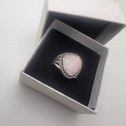 Pink gemstone and sterling silver ring with oxidized beaded detail shown on in white gift box with black insert