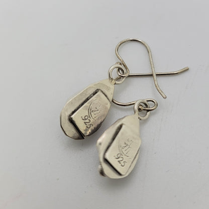 A pair of sterling silver dangle earrings with fishhook wires, featuring engraved 925 silver purity stamps on the teardrop-shaped pendants, shown on a light gray background.