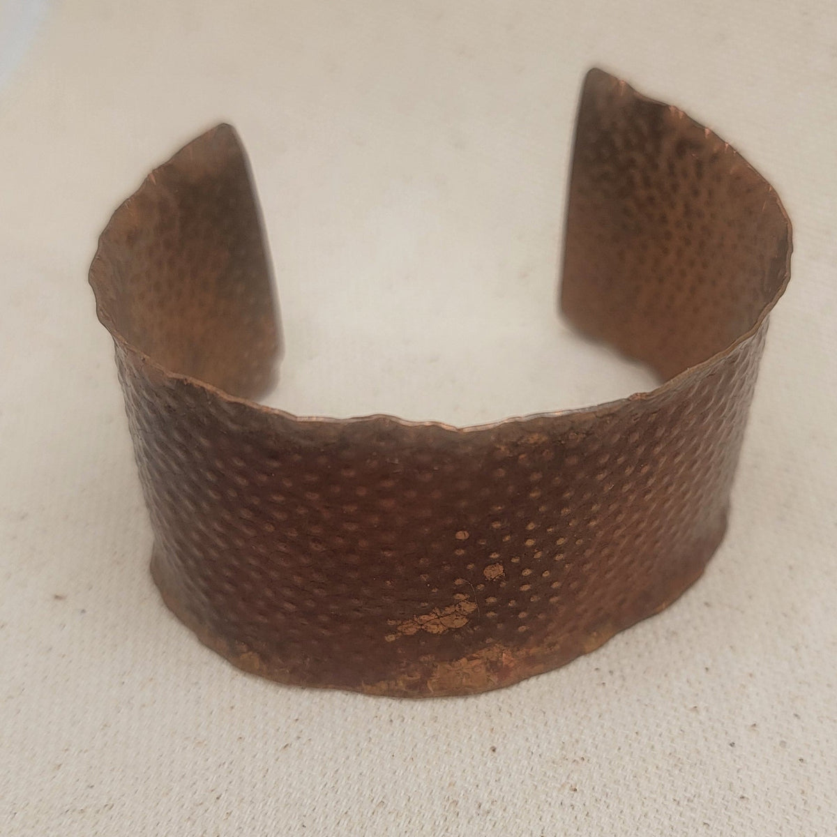 Top view of copper cuff showing its width and texture.