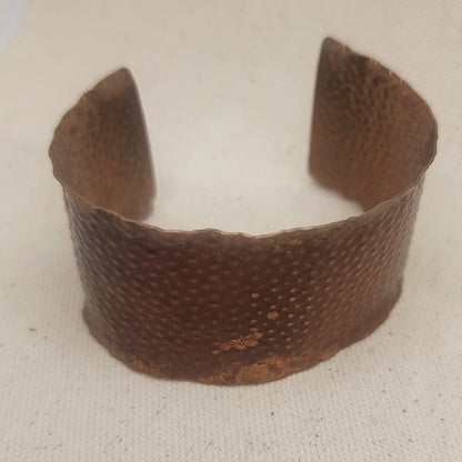 Top view of copper cuff showing its width and texture.