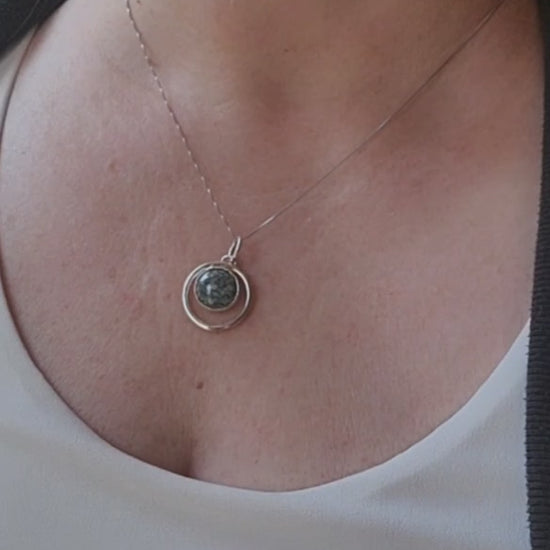 Variscite circle pendant worn on an 18-inch sterling silver chain.