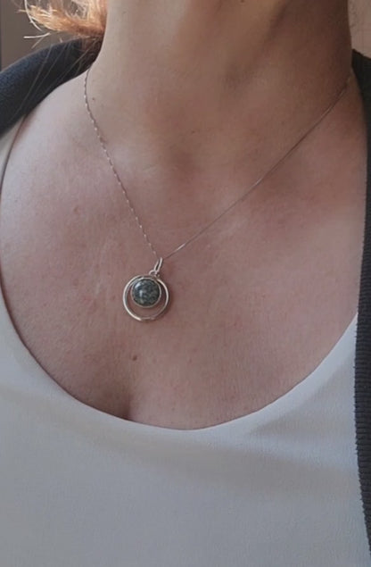 Variscite circle pendant worn on an 18-inch sterling silver chain.