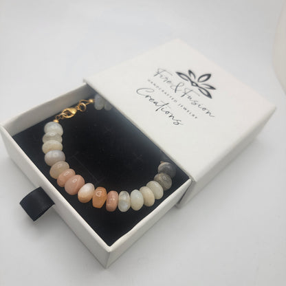 Moonstone beaded bracelet in branded gift box on white background