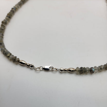 Labradorite bead necklace with a sterling silver lobster clasp on a white background